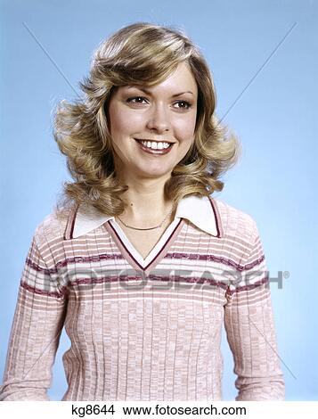 1970s portrait smiling curly blond woman wearing pink stripe sweater View Large Photo Image Picture - 1970s portrait smiling curly blond woman wearing pink stripe sweater. Fotosearch