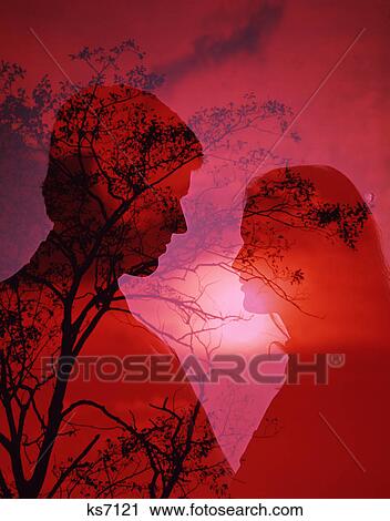 1970s romantic couple man woman silhouetted against tree red sunset View Large Photo Image Stock Image - 1970s romantic couple man woman silhouetted against tree red sunset. Fotosearch