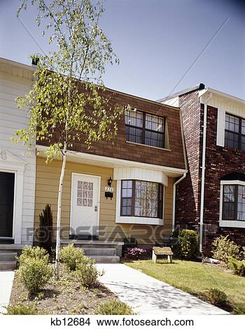 1970s row homes in suburban neighborhood residential community View Large Photo Image Picture - 1970s row homes in suburban neighborhood residential community. Fotosearch