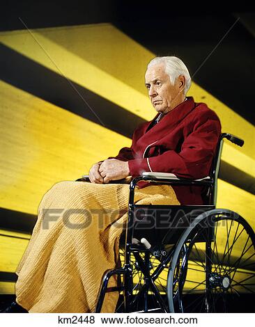 1970s serious sad senior elderly man sitting wheelchair View Large Photo Image Stock Photo - 1970s serious sad senior elderly man sitting wheelchair. Fotosearch