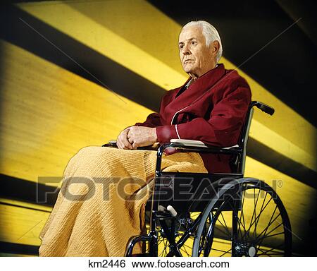 1970s serious senior elderly man sitting wheelchair View Large Photo Image Stock Photograph - 1970s serious senior elderly man sitting wheelchair. Fotosearch