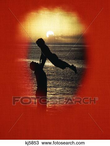 1970s silhouette father lifting up child red vignette linen texture yellow sunset View Large Photo Image Stock Image - 1970s silhouette father lifting up child red vignette linen texture yellow sunset. Fotosearch