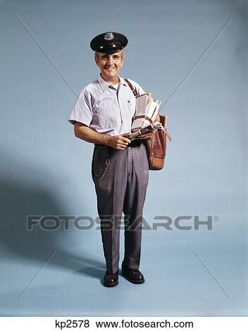 1970s standing full length portrait of middle aged mailman carrying mail bag View Large Photo Image Stock Photo - 1970s standing full length portrait of middle aged mailman carrying mail bag. Fotosearch