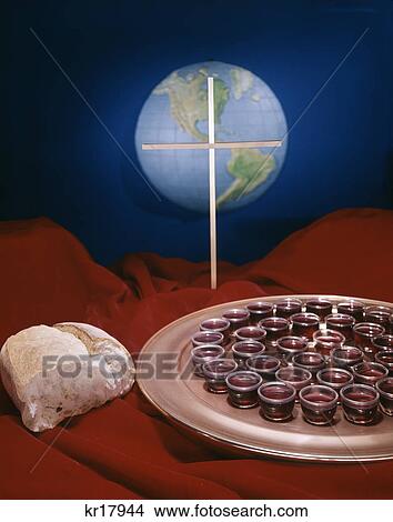 1970s still life bread tray of communion wine with globe earth and cross in background View Large Photo Image Picture - 1970s still life bread tray of communion wine with globe earth and cross in background. Fotosearch