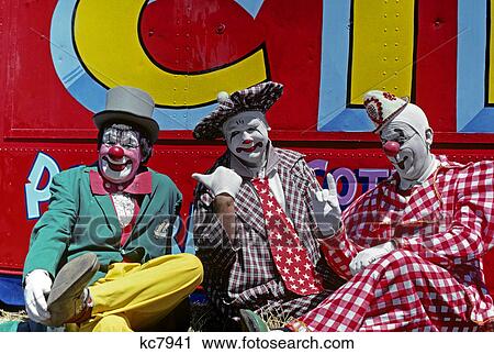 1970s three circus clowns in colorful costumes and hats View Large Photo Image Stock Image - 1970s three circus clowns in colorful costumes and hats. Fotosearch