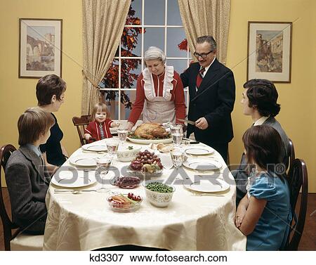 1970s three generation family having thanksgiving dinner View Large Photo Image Stock Photo - 1970s three generation family having thanksgiving dinner. Fotosearch