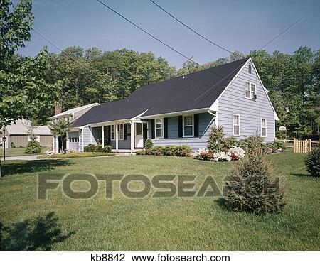 1970s two story blue suburban house with black shutters and landscaped lawn View Large Photo Image Stock Image - 1970s two story blue suburban house with black shutters and landscaped lawn. Fotosearch