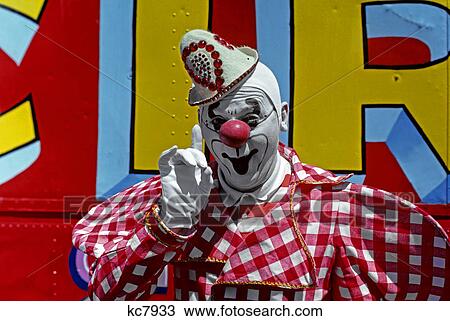 1970s white faced clown in red checked jacket holding up gloved hand View Large Photo Image Stock Image - 1970s white faced clown in red checked jacket holding up gloved hand. Fotosearch