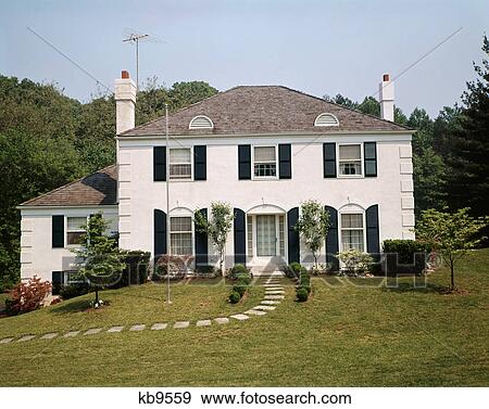 1970s white stucco two story suburban upscale house View Large Photo Image Stock Photo - 1970s white stucco two story suburban upscale house. Fotosearch