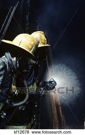 1976 1970s two firefighters use hose to battle fire View Large Photo Image Stock Photo - 1976 1970s two firefighters use hose to battle fire. Fotosearch