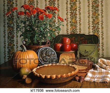 1980s autumn still life of pumpkin pie and chrysanthemums View Large Photo Image Stock Photograph - 1980s autumn still life of pumpkin pie and chrysanthemums. Fotosearch