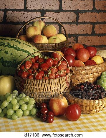 1980s baskets full of fresh summer fruits brick wall background View Large Photo Image Stock Photograph - 1980s baskets full of fresh summer fruits brick wall background. Fotosearch