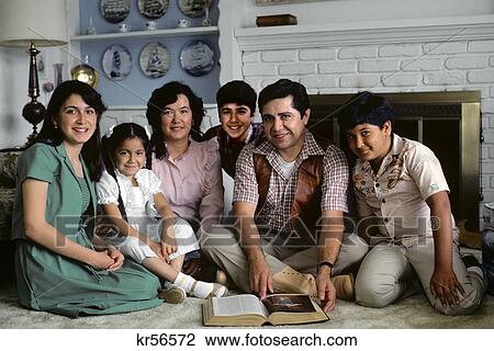 1980s hispanic family portrait in front of fireplace with open bible book View Large Photo Image Stock Image - 1980s hispanic family portrait in front of fireplace with open bible book. Fotosearch