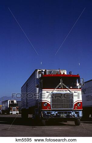 Stock Photography - 1980s mack truck parked at truck stop. Fotosearch
