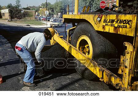 1980s man highway construction worker laying asphalt from truck View Large Photo Image Stock Image - 1980s man highway construction worker laying asphalt from truck. Fotosearch