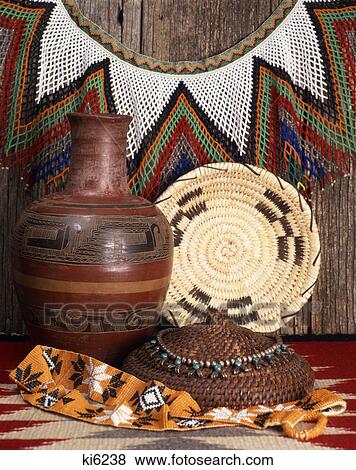 Stock Photo - 1980s still life of native american arts and crafts including indian basket pottery and jewelry. Fotosearch