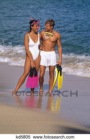 1990s couple with snorkeling gear on beach View Large Photo Image Stock Photography - 1990s couple with snorkeling gear on beach. Fotosearch