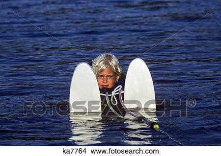 1990s determined little blond girl with water skis View Large Photo Image Picture - 1990s determined little blond girl with water skis. Fotosearch