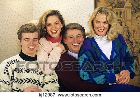 1990s family portrait father mother teenage son and daughter View Large Photo Image Stock Photo - 1990s family portrait father mother teenage son and daughter. Fotosearch