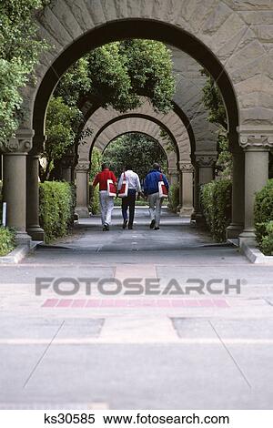 1990s three students walking through campus arches stanford university california View Large Photo Image Stock Photography - 1990s three students walking through campus arches stanford university california. Fotosearch
