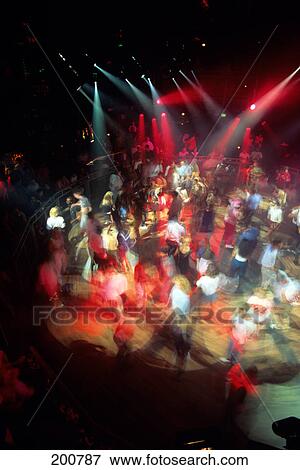 1990s view looking down onto disco dance floor couples dancing colorful spot lights View Large Photo Image Stock Photo - 1990s view looking down onto disco dance floor couples dancing colorful spot lights. Fotosearch