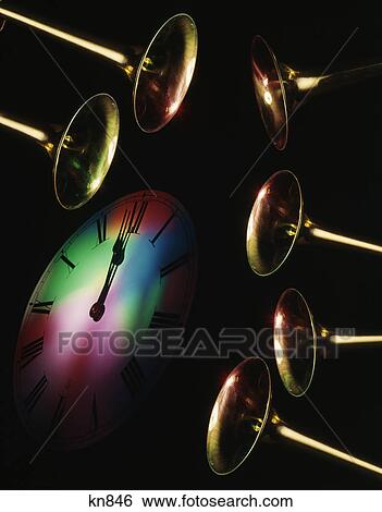 6 brass heralding horns and clock face showing midnight on new years eve View Large Photo Image Stock Photograph - 6 brass heralding horns and clock face showing midnight on new years eve. Fotosearch