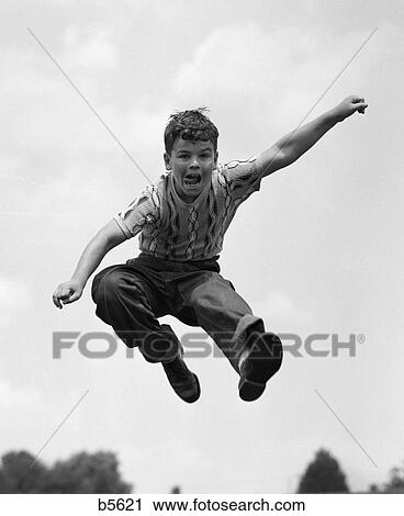 950s boy jumping up View Large Photo Image Stock Image - 950s boy jumping up. Fotosearch