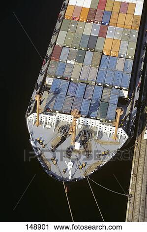 Stock Image - aerial over bow of docked container ship. Fotosearch