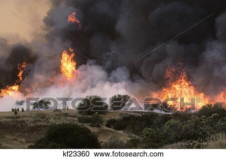 billowing black smoke & flames from forest brush fire ojai, california View Large Photo Image Stock Image - billowing black smoke & flames from forest brush fire ojai, california. Fotosearch