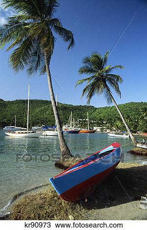 blue red canoe anchored sailboats port elizabeth admiralty bay bequia island west indies View Large Photo Image Stock Image - blue red canoe anchored sailboats port elizabeth admiralty bay bequia island west indies. Fotosearch