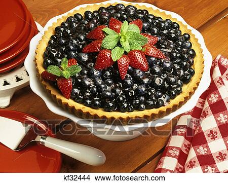 blueberry tart with strawberries and mint leaf View Large Photo Image Picture - blueberry tart with strawberries and mint leaf. Fotosearch