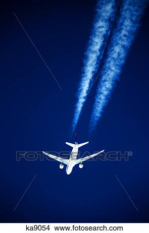 boeing 767 in flight with contrail View Large Photo Image Picture - boeing 767 in flight with contrail. Fotosearch