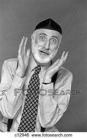 Stock Photograph - character portrait man gray beard wear yarmulke hebrew jewish skullcap hands up to face gesture funny expression oy! worry complain kvetch. Fotosearch