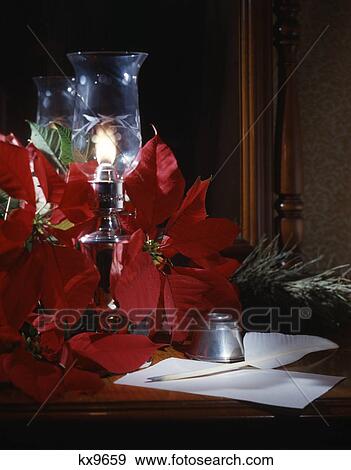 christmas still life candle poinsettia pen ink quill View Large Photo Image Stock Photo - christmas still life candle poinsettia pen ink quill. Fotosearch