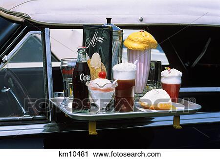 close-up of food tray on car window in 1950s style drive-in restaurant View Large Photo Image Stock Image - close-up of food tray on car window in 1950s style drive-in restaurant. Fotosearch