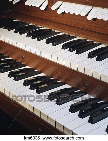 Stock Photography - close-up of organ dual keyboard & stops. Fotosearch