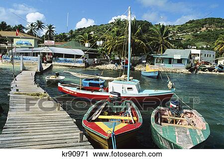 colorful local fishing boats dock sunny grenadines yacht club clifton harbor union island west indies View Large Photo Image Stock Image - colorful local fishing boats dock sunny grenadines yacht club clifton harbor union island west indies. Fotosearch