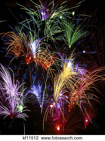 colorful polychrome fireworks bursting in night sky View Large Photo Image Stock Image - colorful polychrome fireworks bursting in night sky. Fotosearch