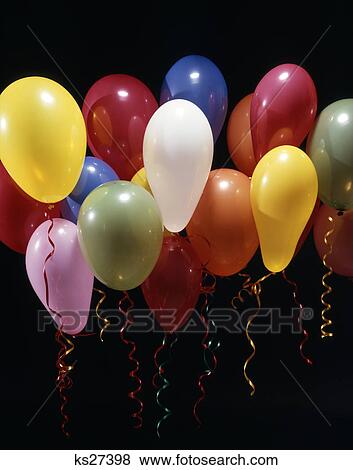 Stock Photo - colorful rainbow arrangement of balloons tied with twisted ribbon ribbons party celebration decoration inflated floating. Fotosearch
