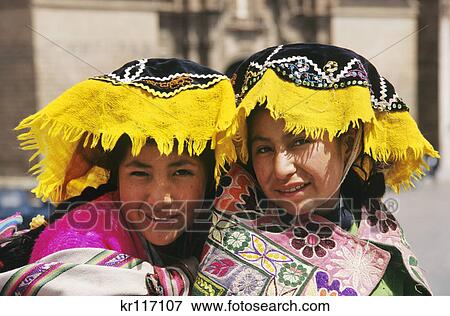 Stock Photo - cuzco, peru indian girls in colorful native dress. Fotosearch