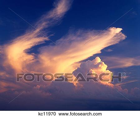 dramatic clouds reflecting sunset glow View Large Photo Image Stock Image - dramatic clouds reflecting sunset glow. Fotosearch