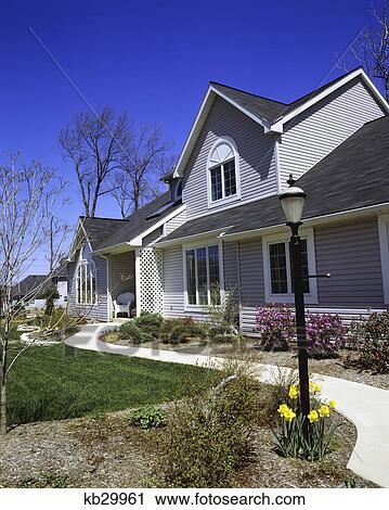 early spring scene gray house with daffodils and lamppost View Large Photo Image Stock Image - early spring scene gray house with daffodils and lamppost. Fotosearch