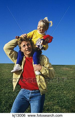 father with daughter on shoulders View Large Photo Image Stock Photograph - father with daughter on shoulders. Fotosearch