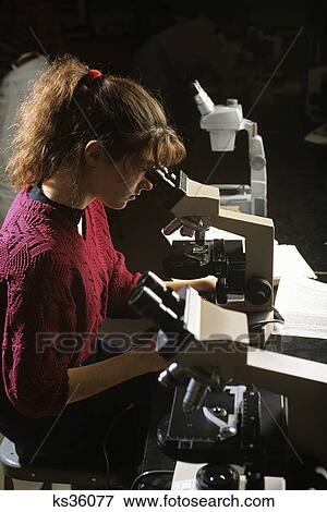 female college student using microscope in science lab View Large Photo Image Stock Photo - female college student using microscope in science lab. Fotosearch