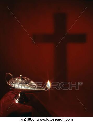 flame in brass lamp of knowledge and shadow of cross on red background View Large Photo Image Stock Image - flame in brass lamp of knowledge and shadow of cross on red background. Fotosearch