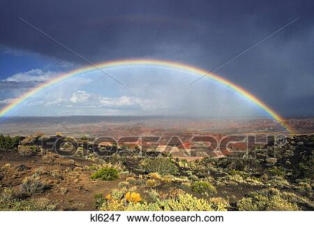 Stock Photo - full rainbow over painted desert arizona. Fotosearch