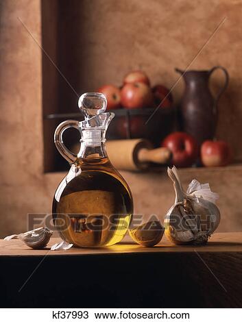 garlic and flax seed oil apples in background View Large Photo Image Stock Image - garlic and flax seed oil apples in background. Fotosearch