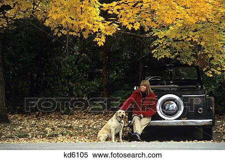 girl sitting on car bumper with dog View Large Photo Image Stock Photography - girl sitting on car bumper with dog. Fotosearch