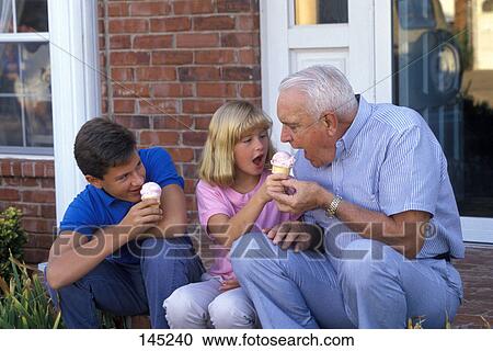 grandfather sharing ice cream cone with grandchildren View Large Photo Image Stock Image - grandfather sharing ice cream cone with grandchildren. Fotosearch