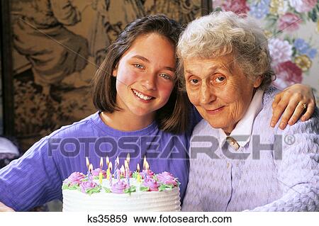 grandmother and granddaughter birthday celebration View Large Photo Image Stock Photo - grandmother and granddaughter birthday celebration. Fotosearch
